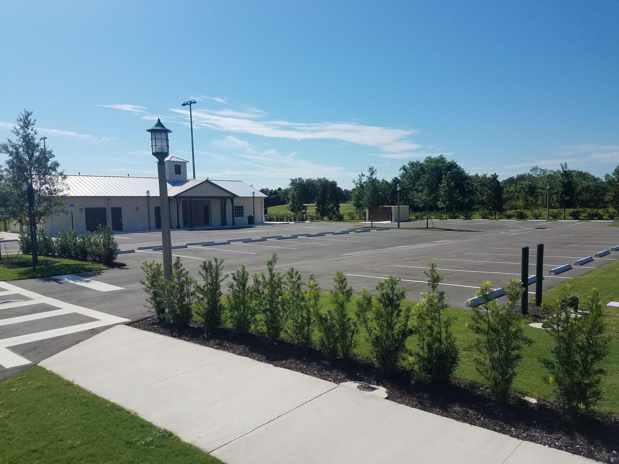 Camcor finished parking lot with landscaping and building